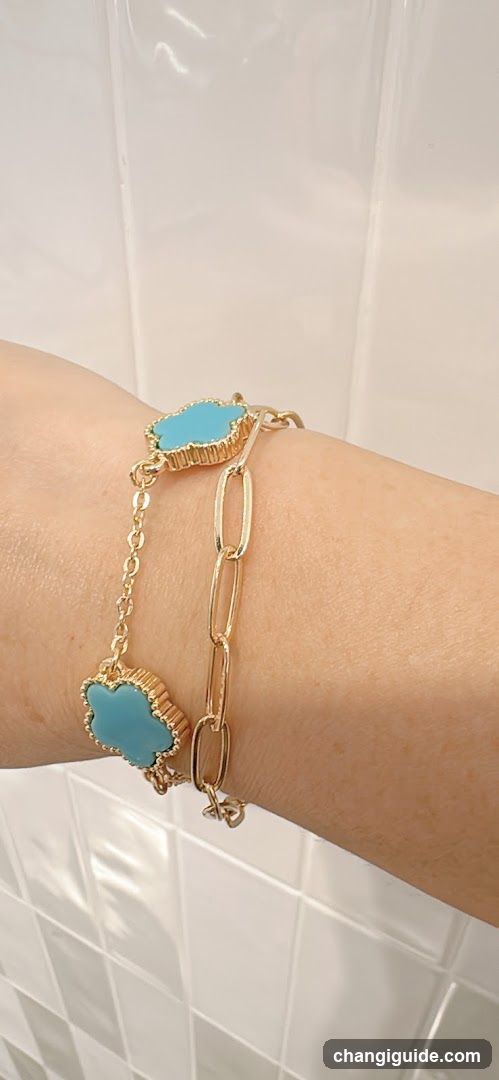 Gold and turquoise bracelet on wrist