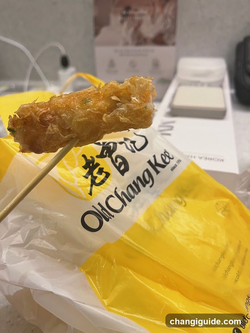Fried food item on skewer with packaging