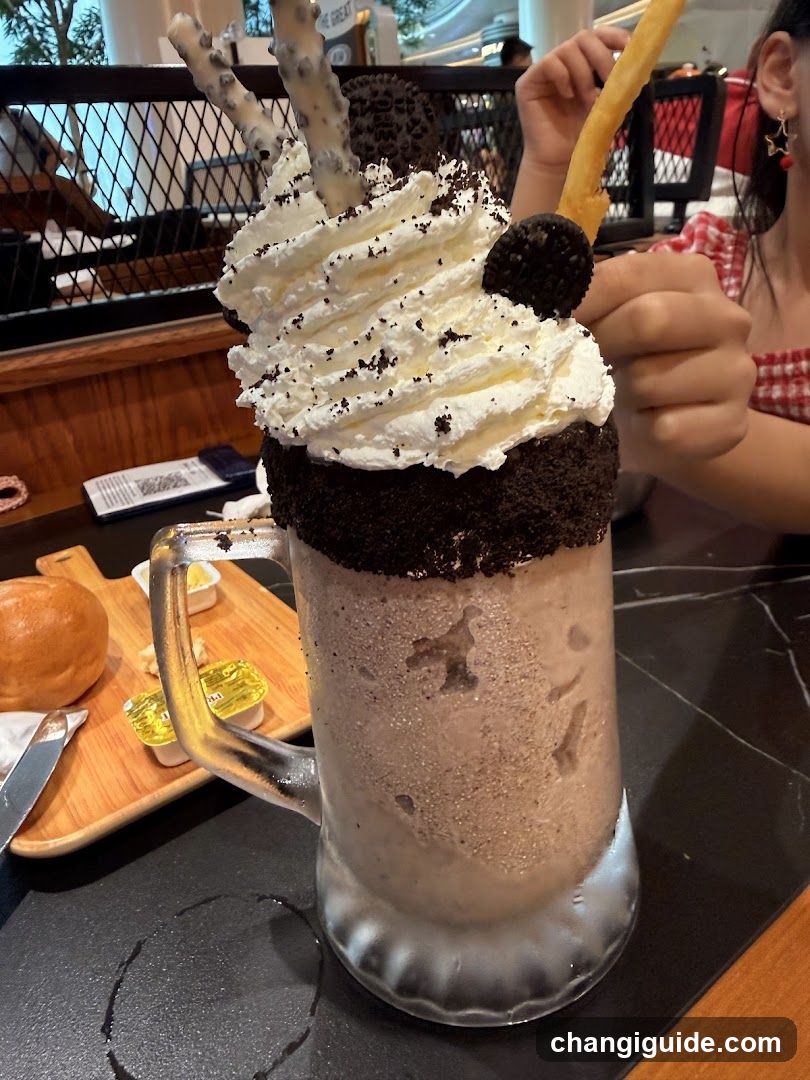 Oreo Milkshake with Whipped Cream and Cookie Crumbs