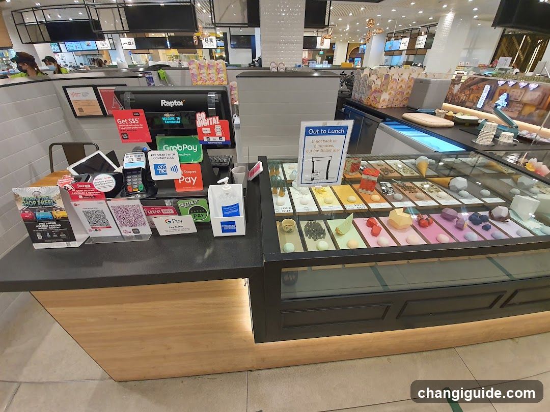 Food Counter with Payment Terminals and Dessert Display