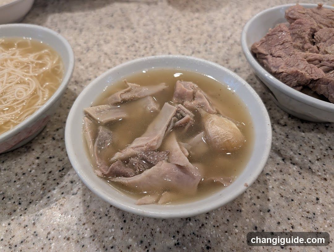 Bowl of Soup with Meat and Noodles
