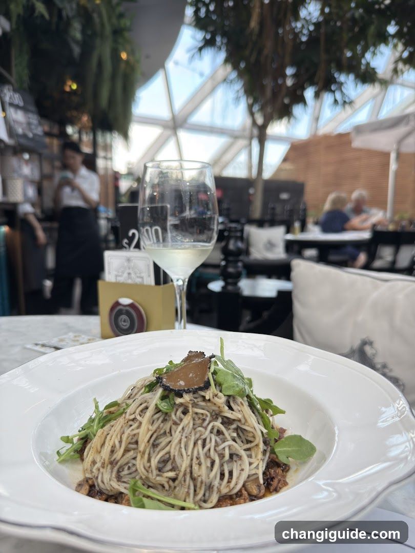 Pasta Dish with Wine in Restaurant Interior