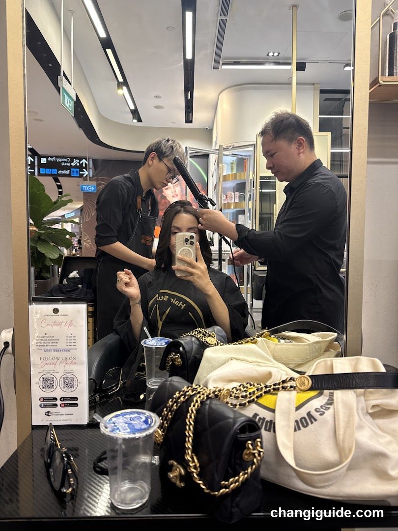 Hair Salon Interior with Stylists and Customer