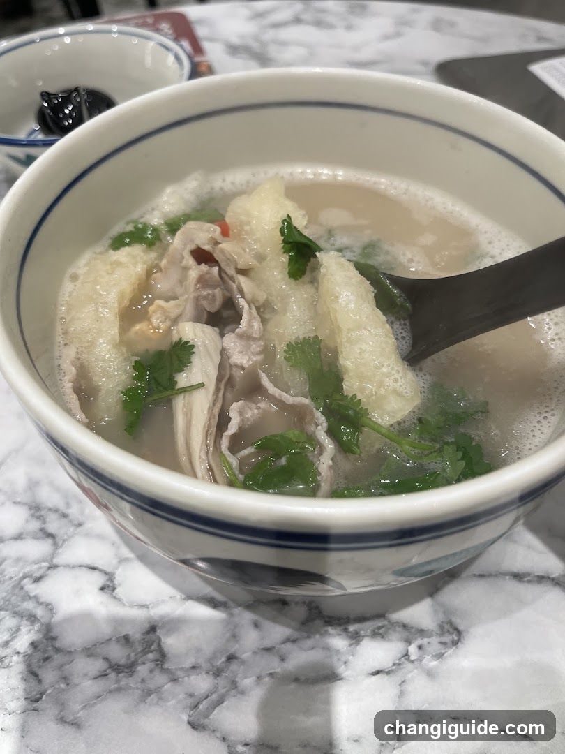 Bowl of Soup with Meat and Greens