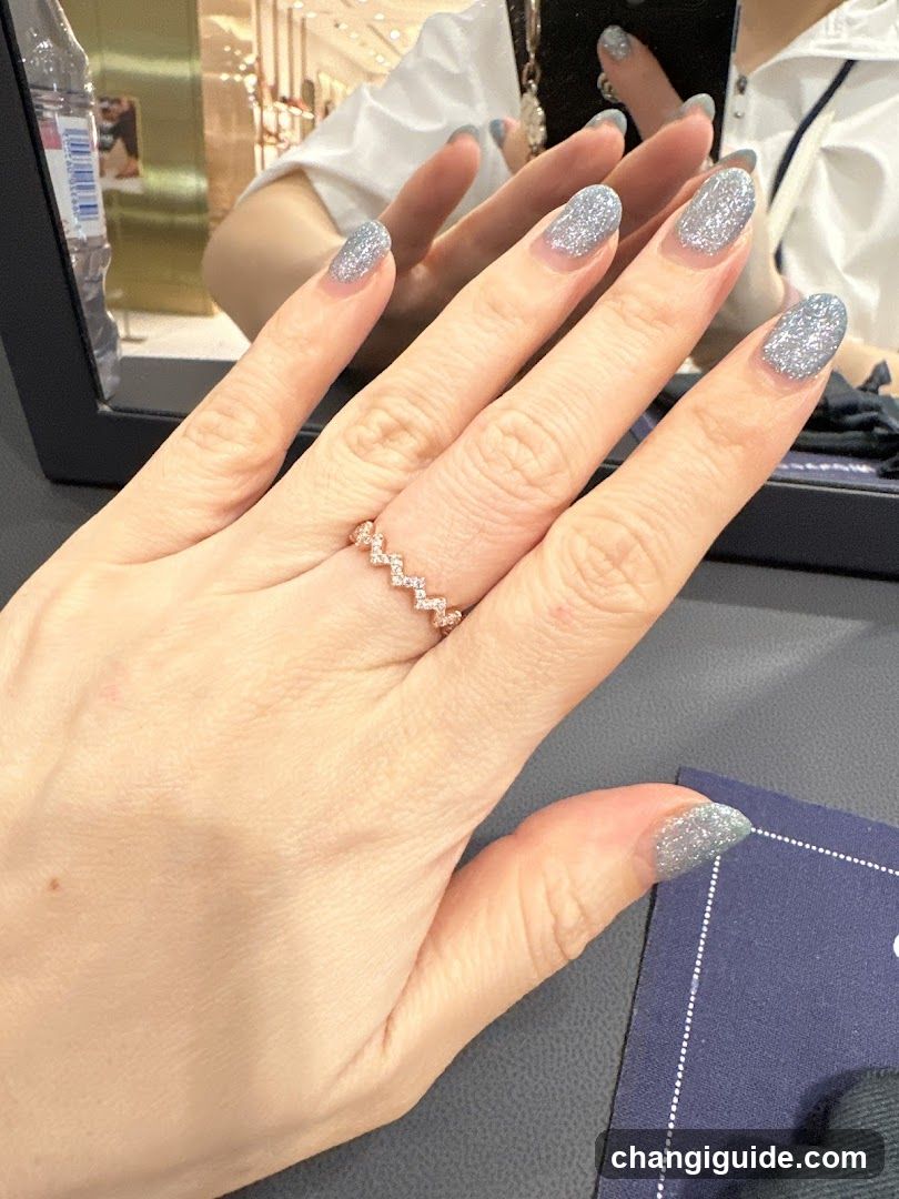 Hand with Glitter Nail Art and Ring