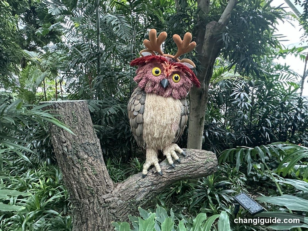 Owl Sculpture in Garden Setting