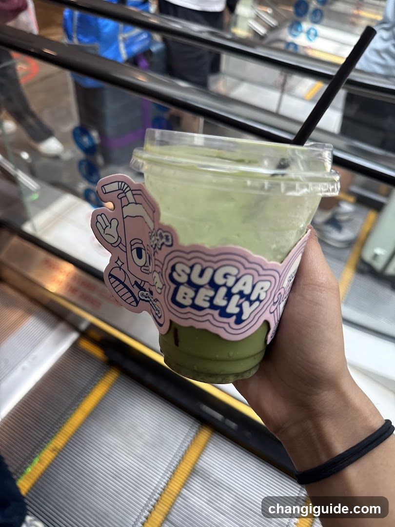 Sugar Belly Drink on Escalator
