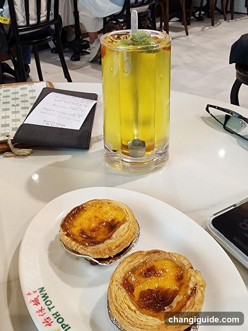 Egg Tart and Drink on Table