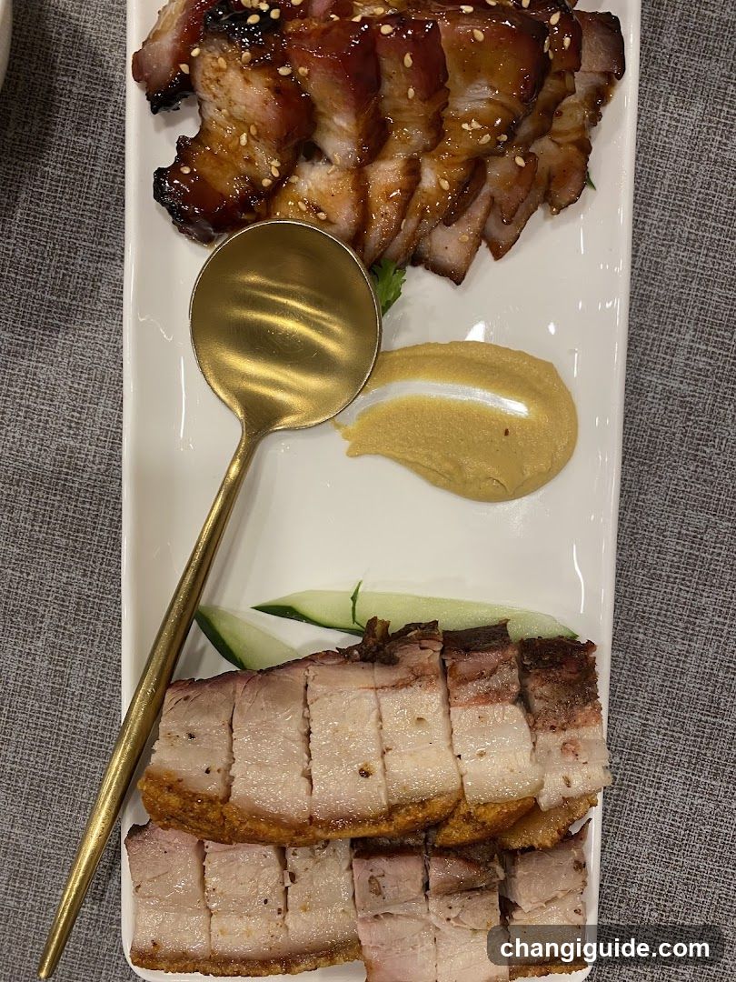 Sliced Roasted Meat Platter with Sauce and Cucumber