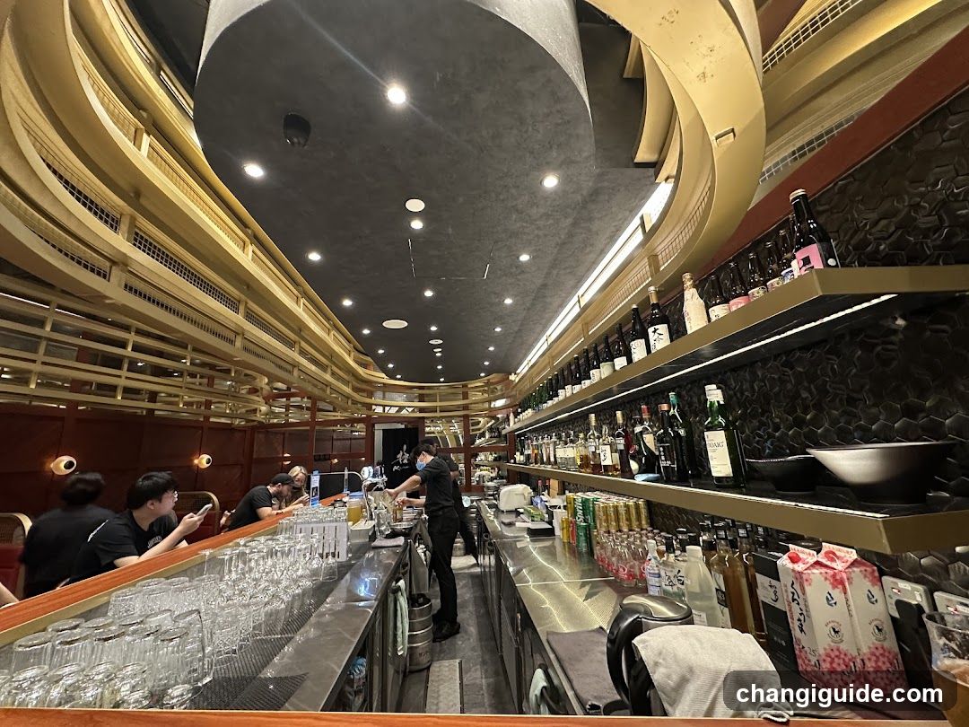 Bar Interior with Staff and Bottles