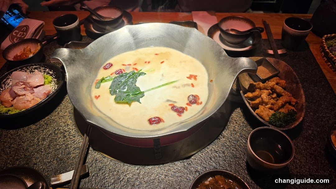 Dining Table with Hot Pot and Side Dishes