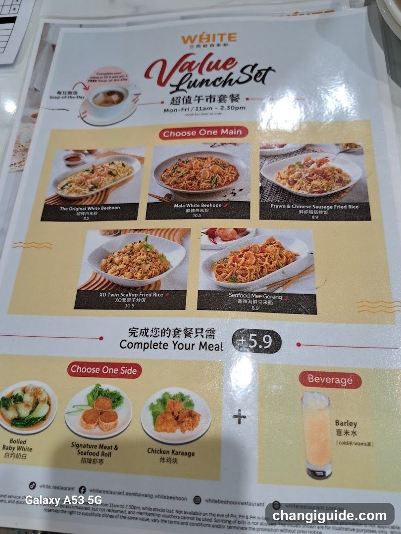 A printed menu page advertising a value lunch set at White Restaurant, featuring five main rice dishes and three side options with prices listed in SGD.
