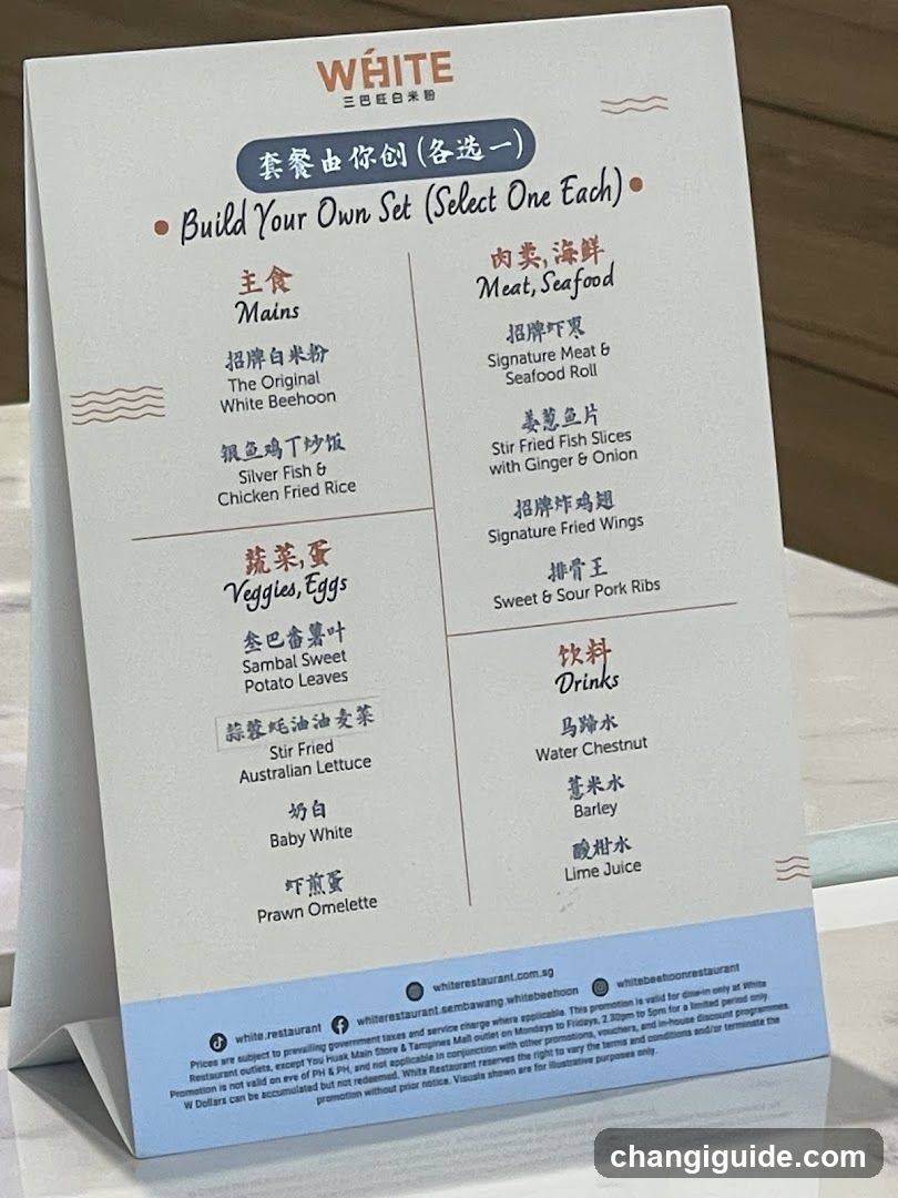 A printed menu board displaying a 'Build Your Own Set' option with categories for Mains, Meat/Seafood, Veggies/Eggs, and Drinks. Each category lists three items to choose from.