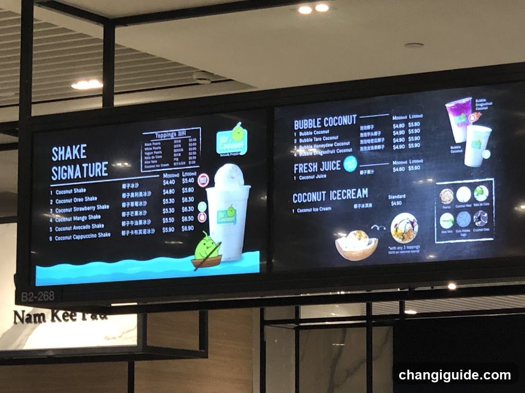 Digital menu board displaying shake and juice options with prices.