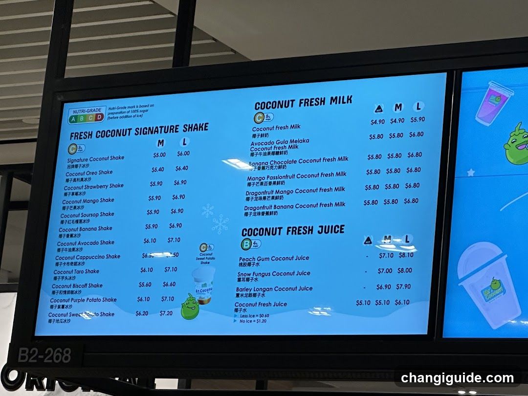A digital menu board displaying coconut-themed drinks, including signature shakes and fresh milk options with prices listed in M/L sizes.