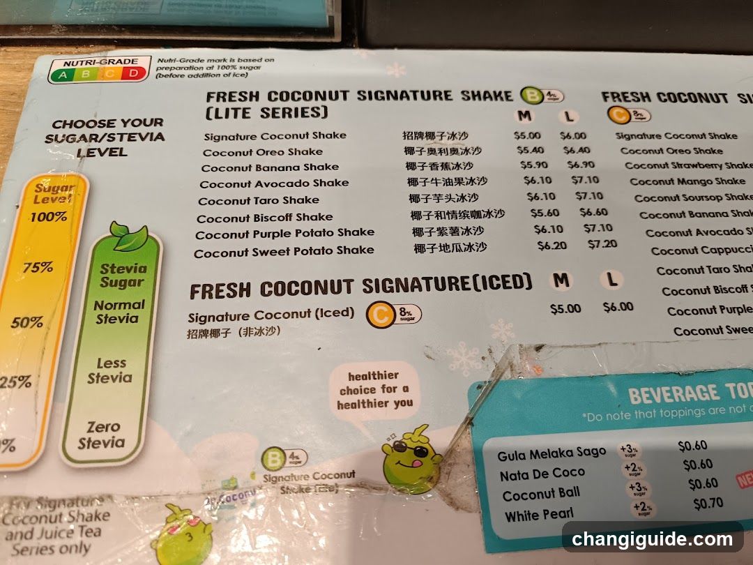 A printed menu featuring fresh coconut signature shakes and iced versions, with sugar/stevia level options and topping prices.