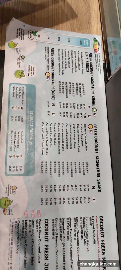 A printed menu featuring fresh coconut signature shakes, including life series and signed versions with prices listed in dollars.