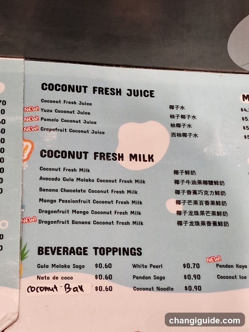 A printed menu page featuring sections for Coconut Fresh Juice, Coconut Fresh Milk, and Beverage Toppings with prices in USD.