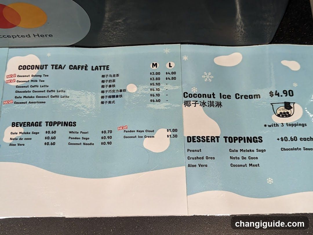 A printed menu featuring coconut tea and coffee drinks, ice cream, beverage toppings, and dessert toppings with prices in USD.