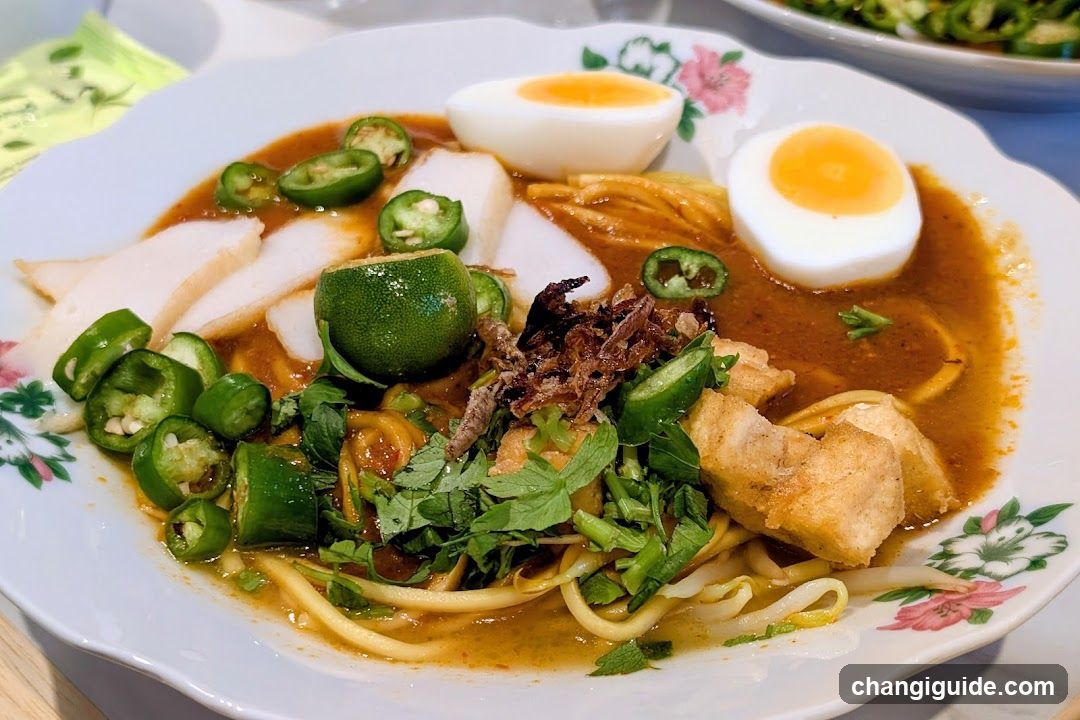 Spicy Noodle Bowl with Halved Eggs and Peppers
