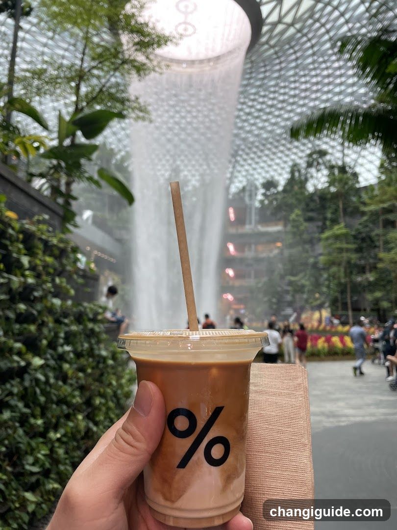 Coffee with % logo in foreground