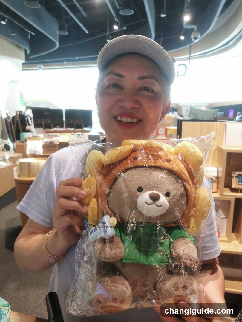 Person holding plush toy in store