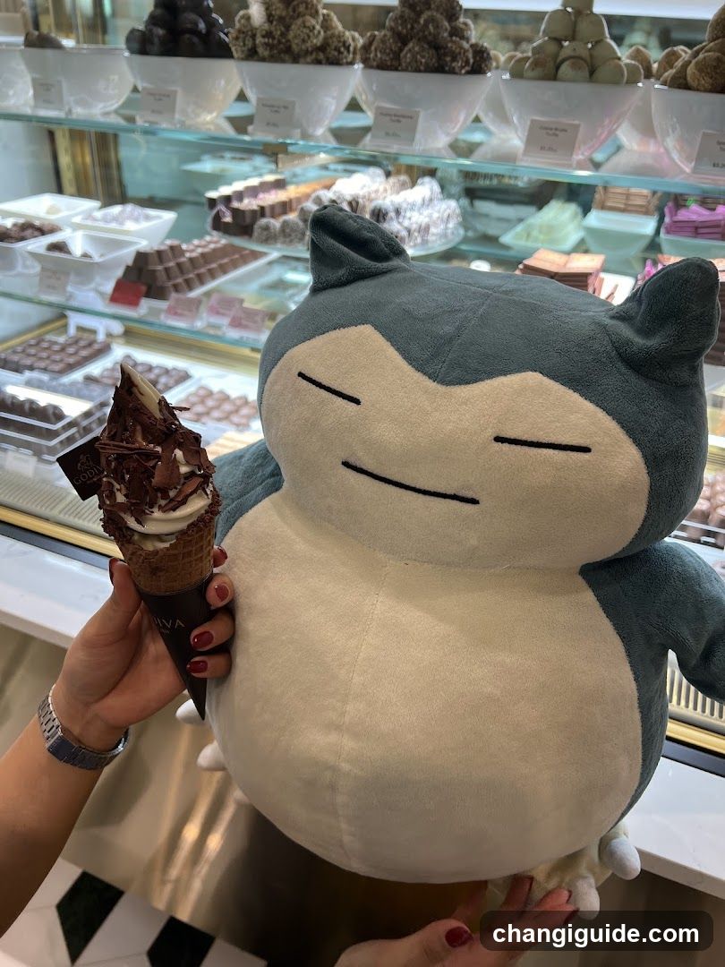 Snorlax plushie with ice cream cone in a confectionery shop
