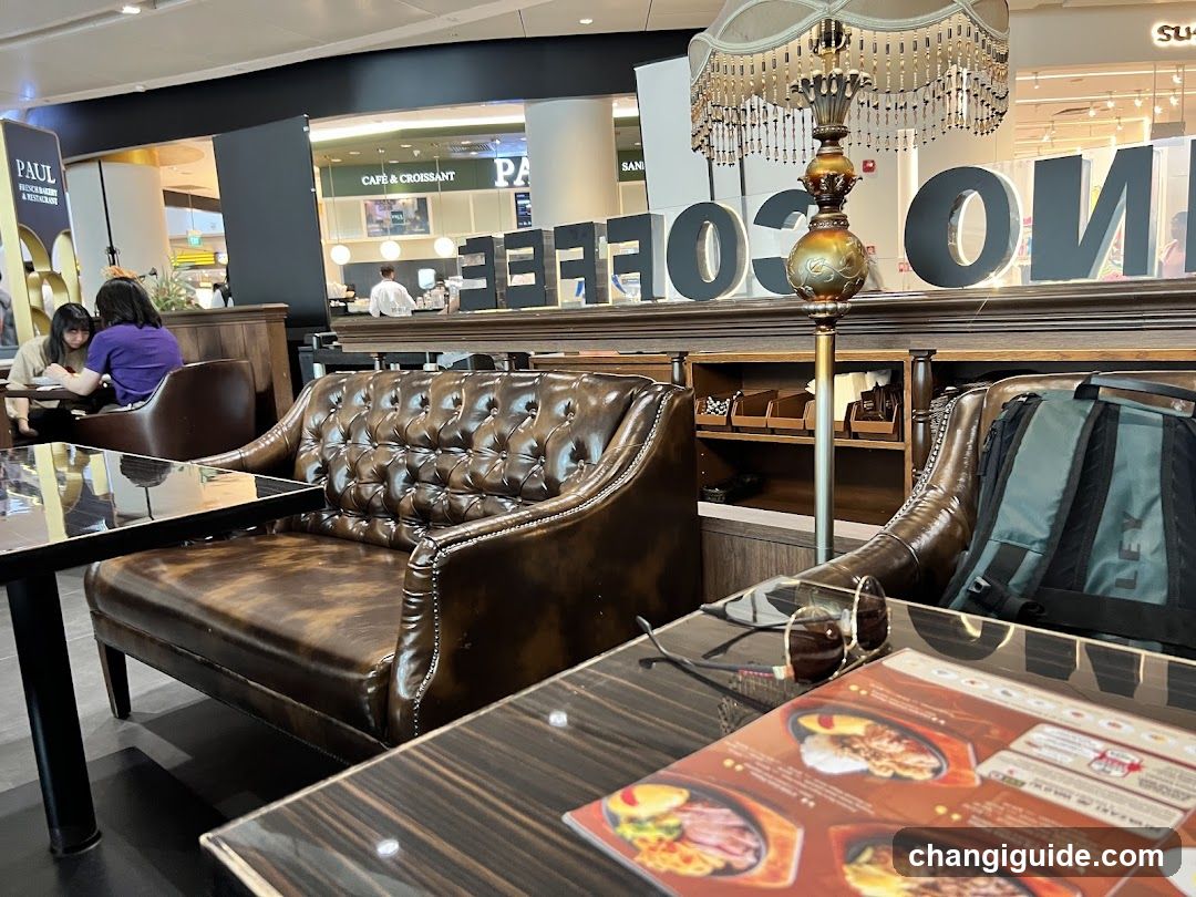 Coffee Shop Interior with Leather Seating and Menu Display