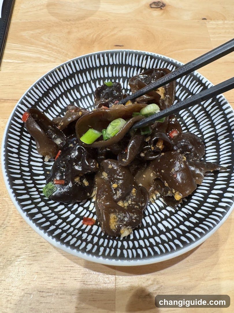 Bowl of black fungus with green onions and chili