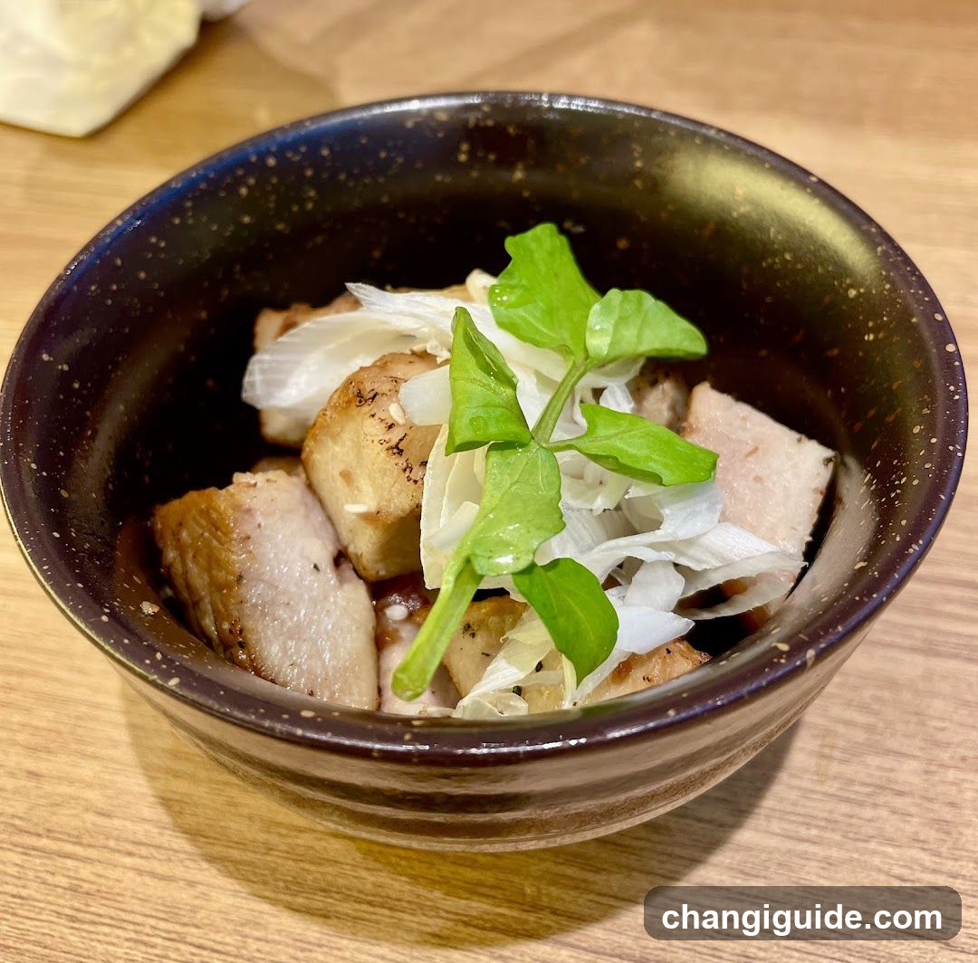 Bowl of Grilled Pork with Greens and Onions