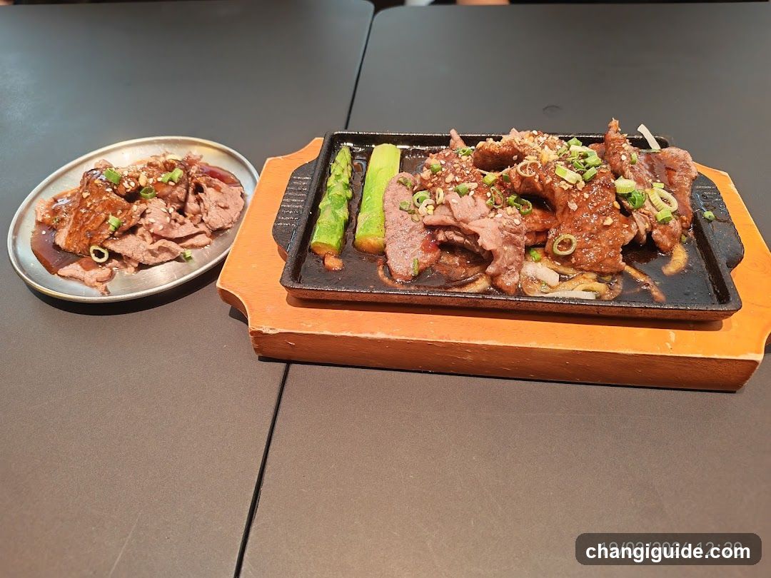 Sizzling Meat Dish with Side Plate