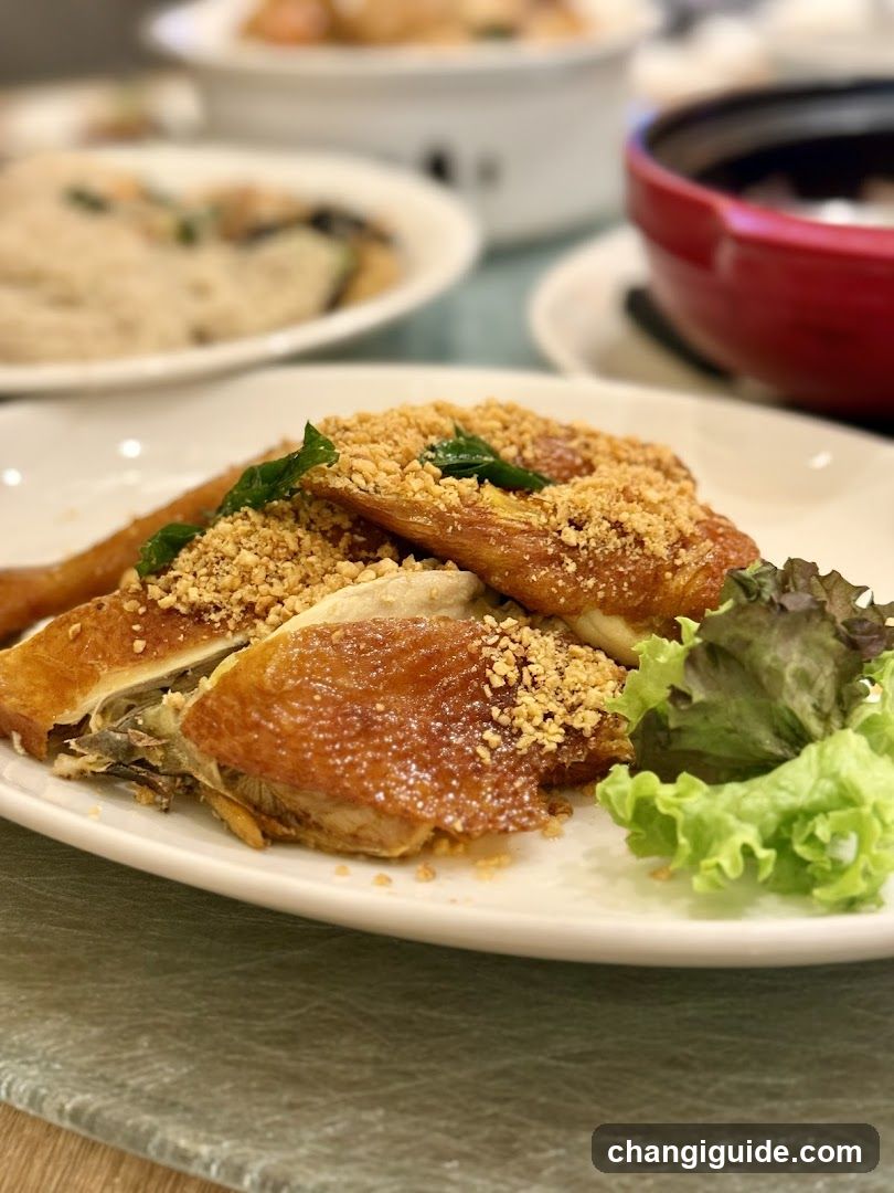 Crispy Chicken Dish with Crumbs and Lettuce Garnish