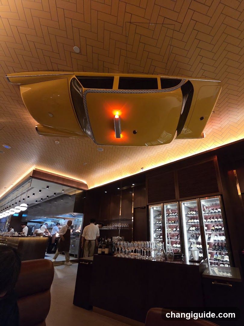 Interior of a modern bar or restaurant with suspended car art