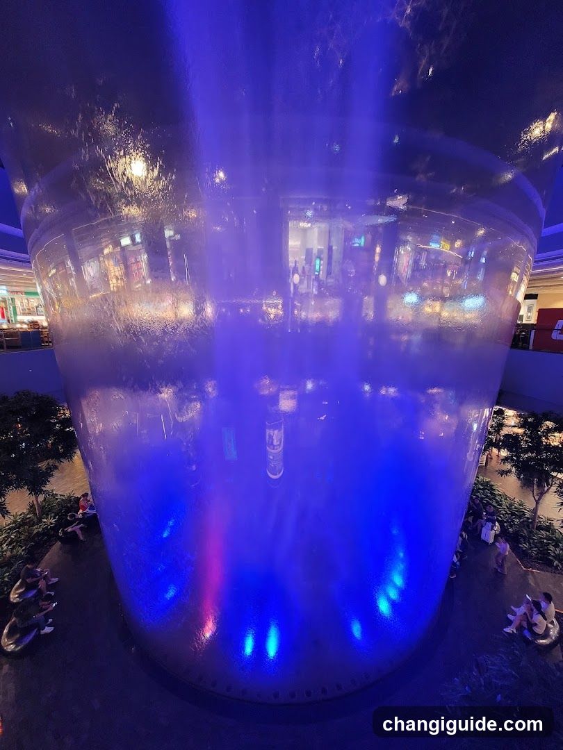 Blue-lit Water Feature in Mall Interior