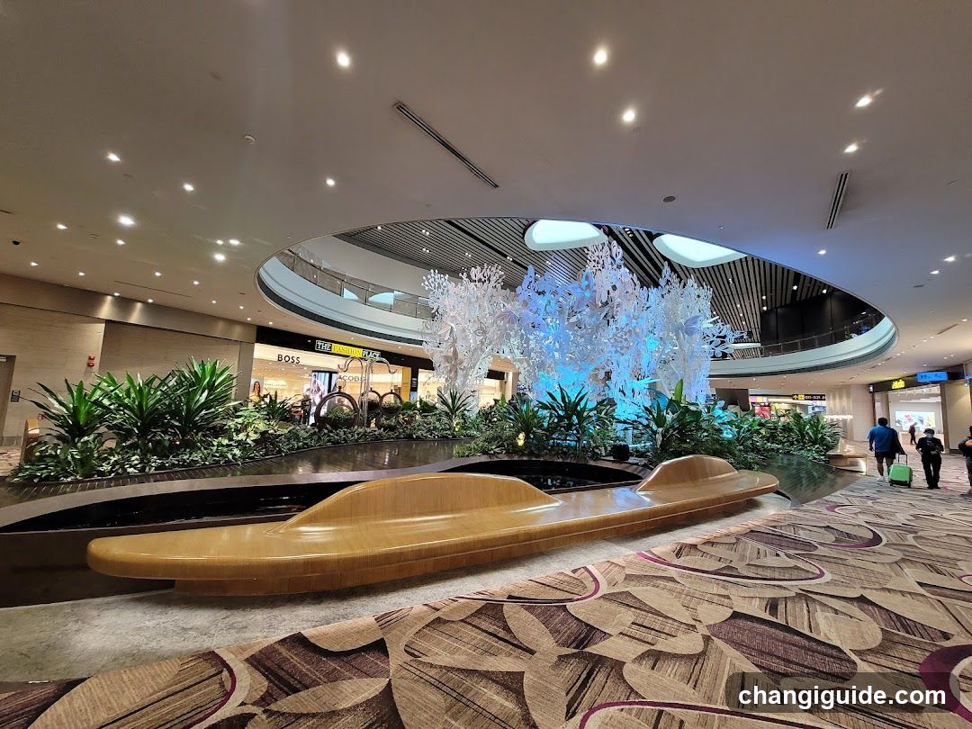 Airport Terminal Interior with Decorative Fountain and Greenery