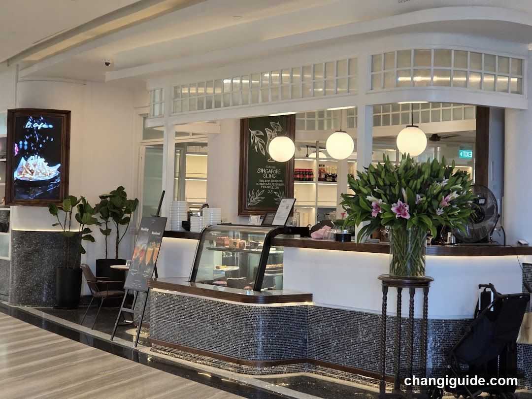 Interior Cafe Counter with Menu Board and Floral Display