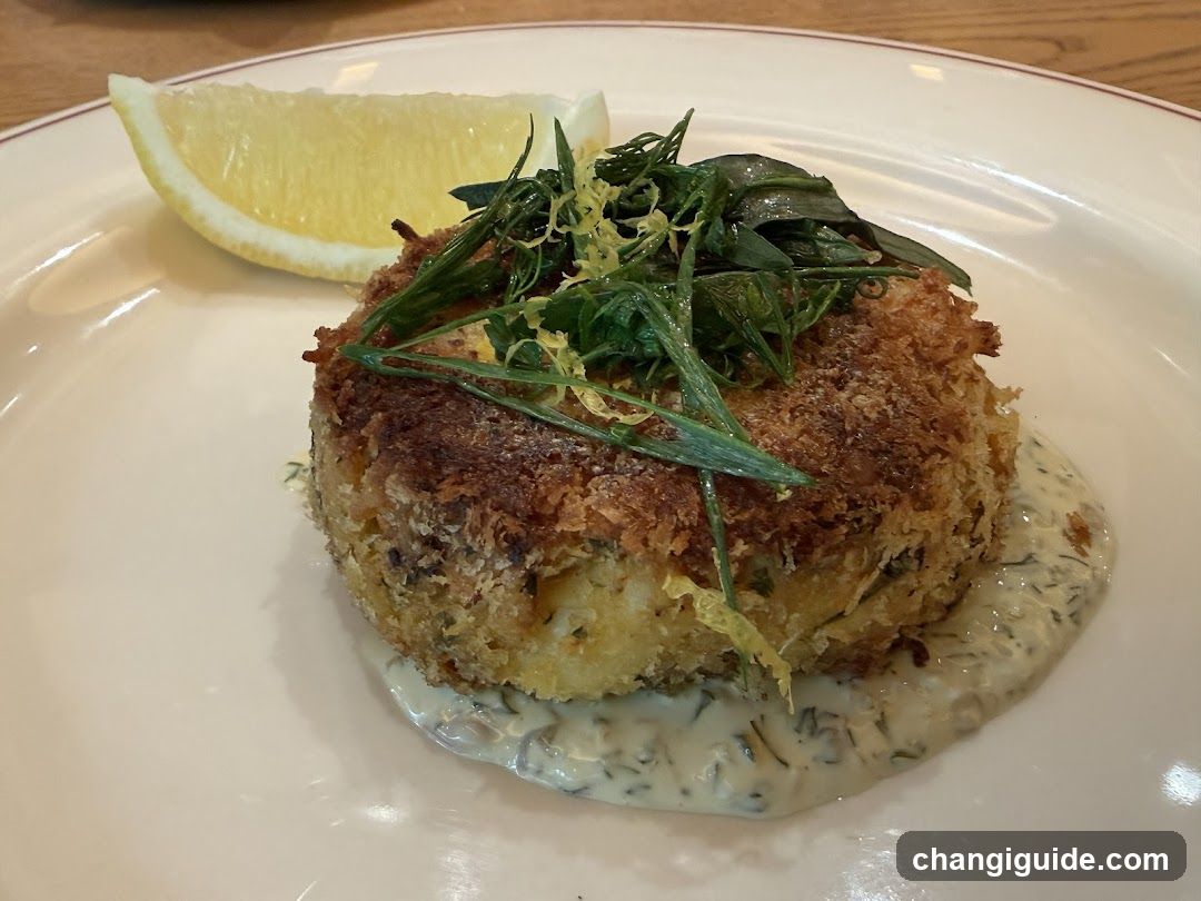 Crispy Fish Cake with Sauce and Garnish