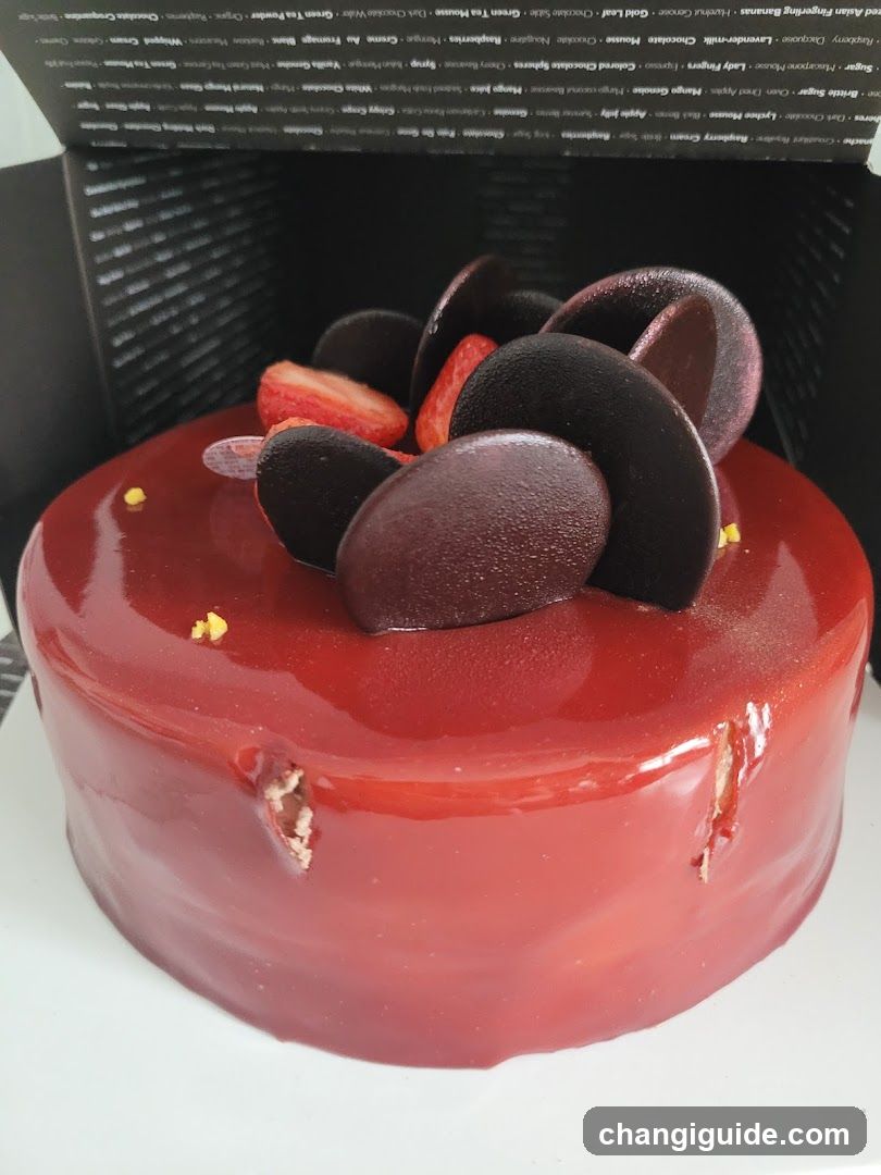 Red Glazed Cake with Dark Chocolate and Strawberry Topping