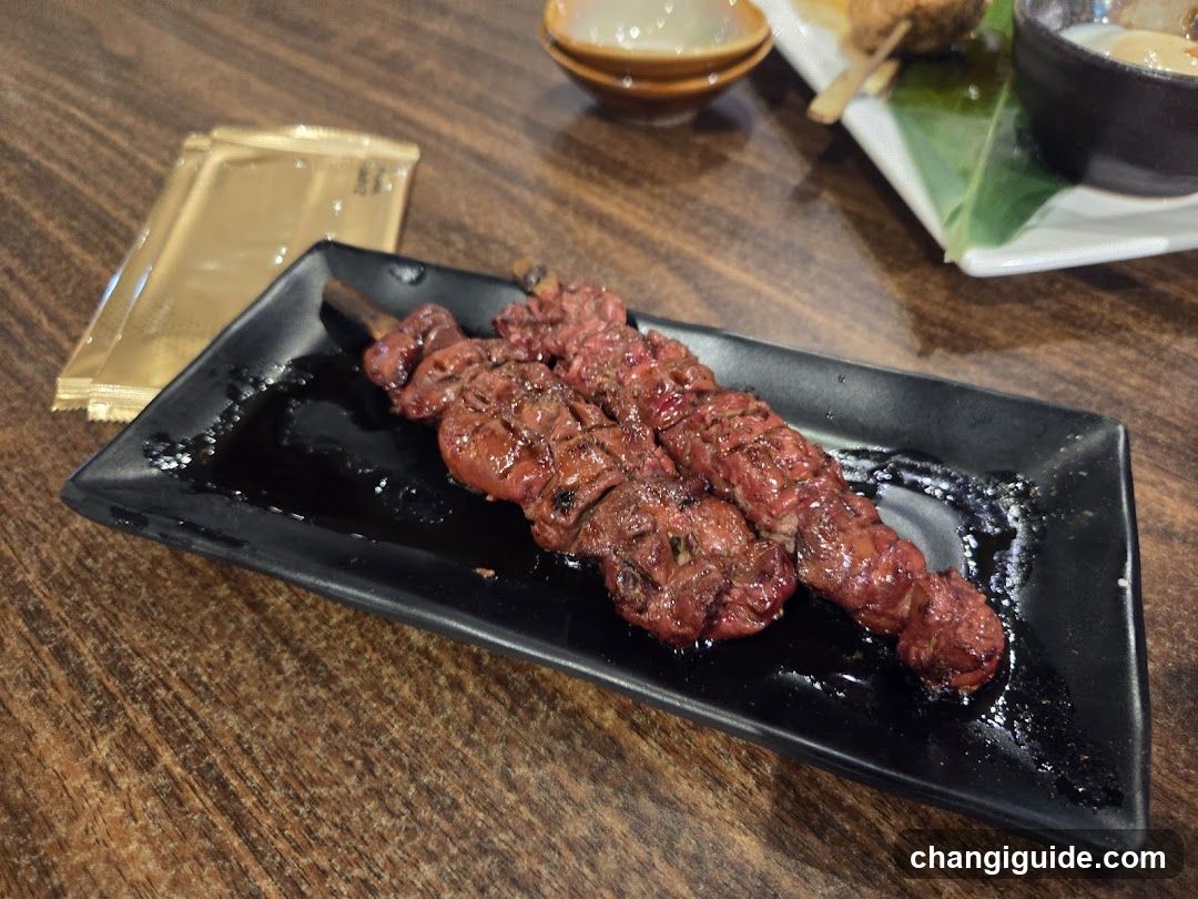 Grilled Skewers on Black Plate