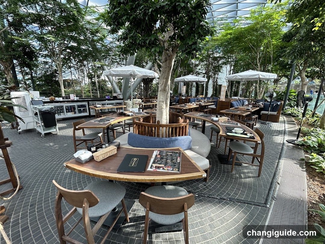 Outdoor Dining Area with Greenery and Seating
