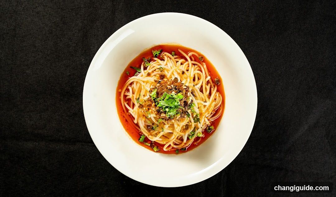 Spicy Noodle Dish in White Bowl