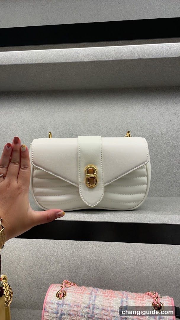 White Quilted Handbag Display
