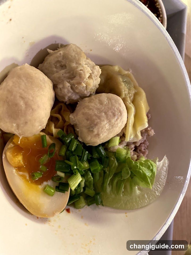 Bowl of Noodles with Meatballs and Egg