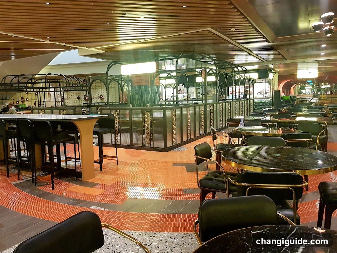 Interior of a modern dining area with bar and tables