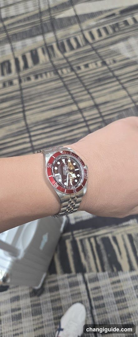 Watch on wrist with patterned background