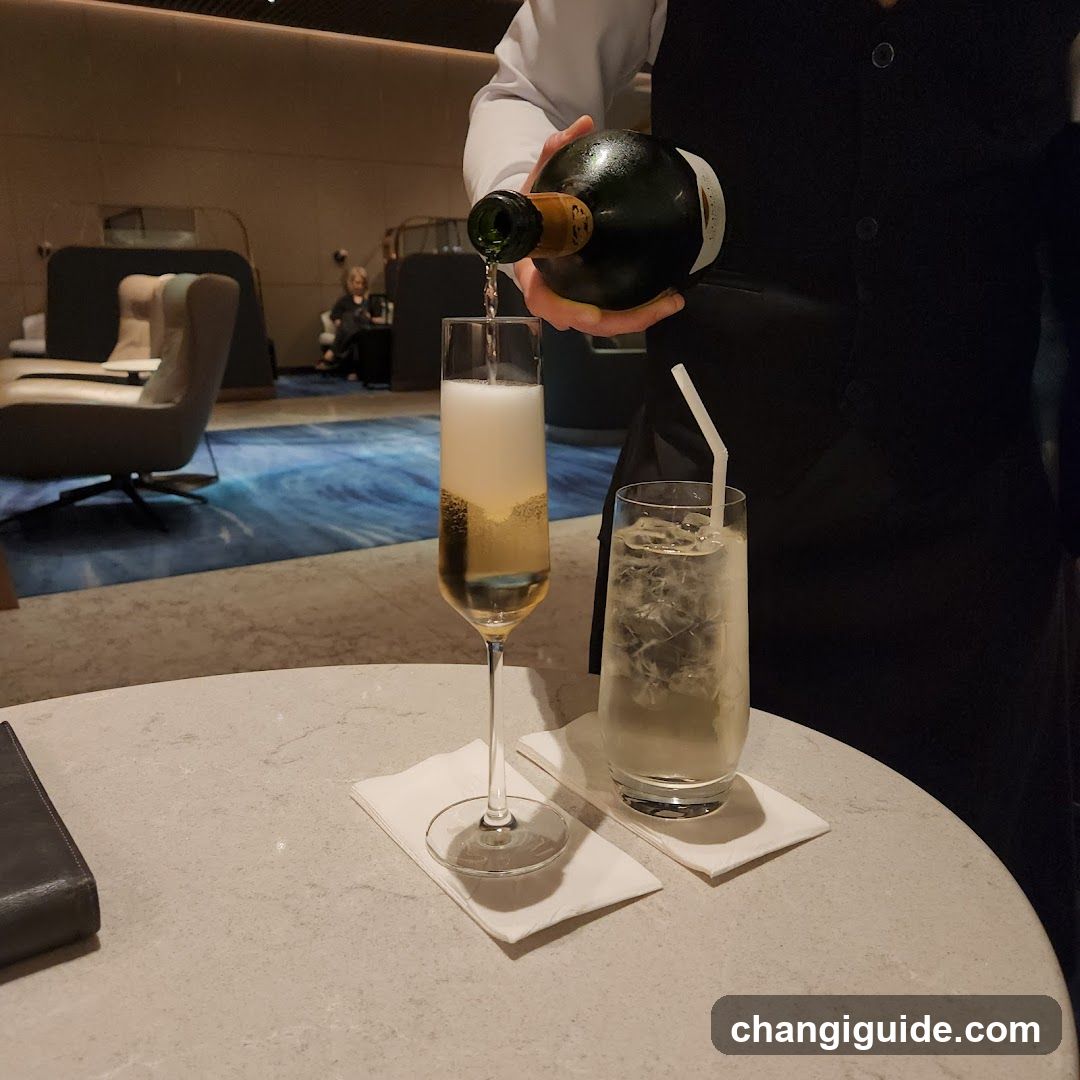Waiter Pouring Champagne in Lounge