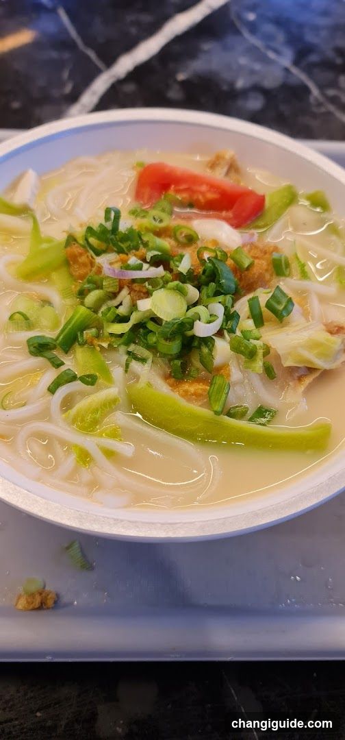 Bowl of Noodle Soup with Garnish