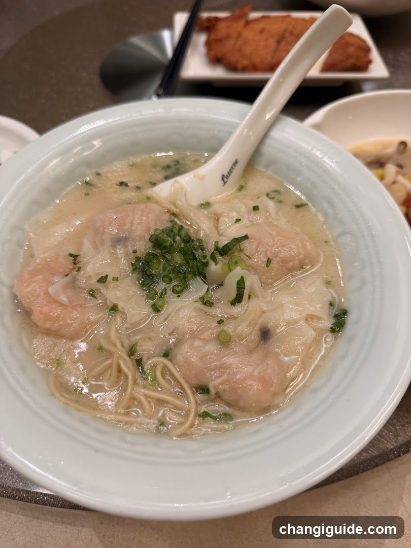 Wonton Noodle Soup with Chopsticks and Spoon