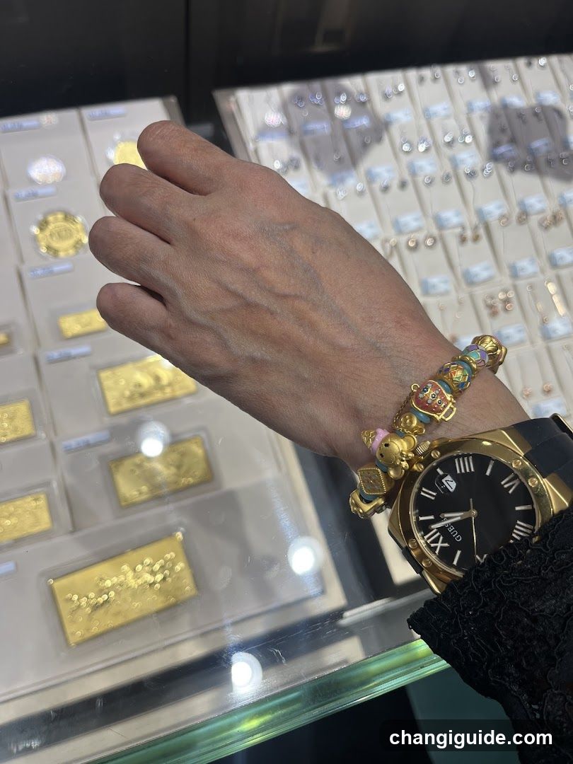 Jewelry Display Case with Gold Watch and Bracelet