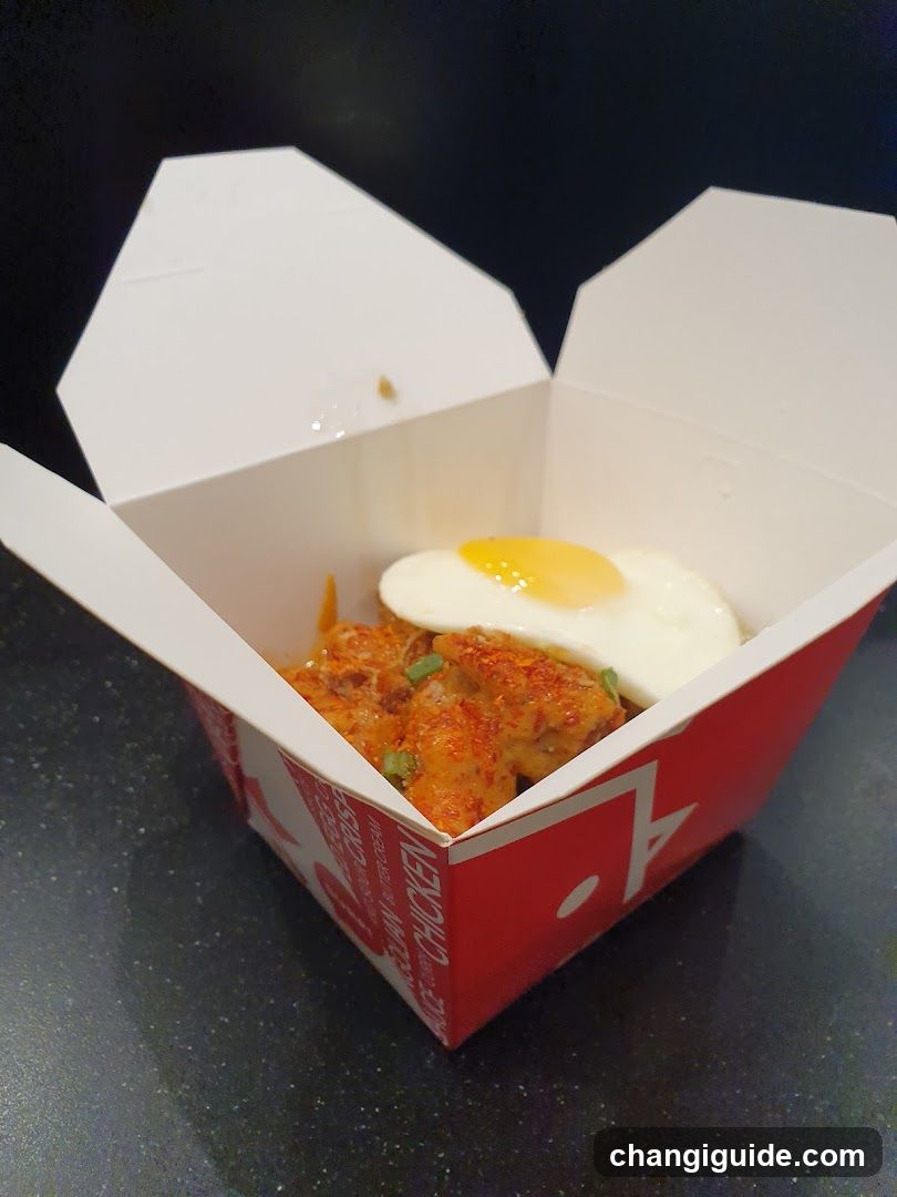 Takeout Box with Fried Egg and Spicy Chicken